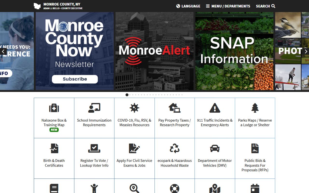 Monroe County government website homepage showing departments and services available to residents